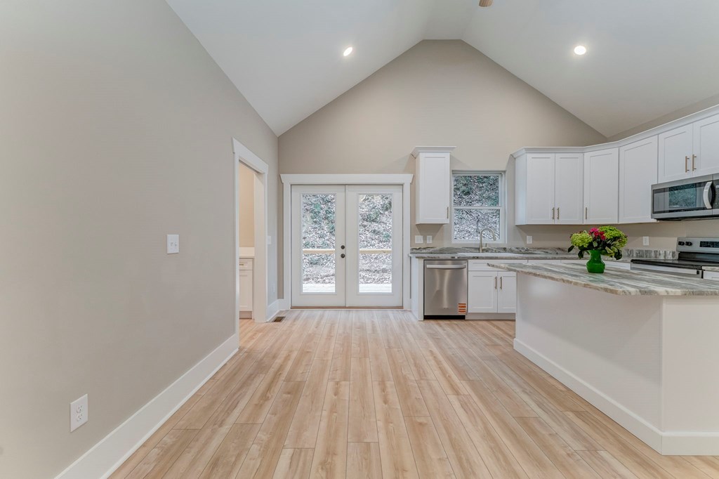 79 Logan Lane Ellijay, GA 30540 - Photo 29 of 56 a kitchen with white cabinets and appliances