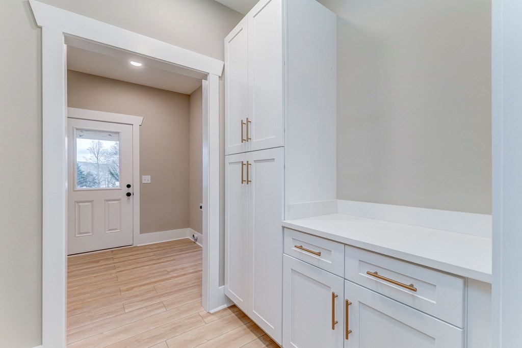 79 Logan Lane Ellijay, GA 30540 - Photo 35 of 56 a view of a hallway with wooden floor