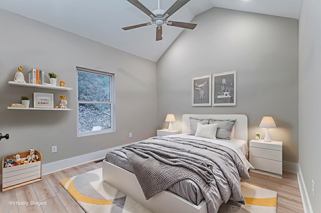 79 Logan Lane Ellijay, GA 30540 - Photo 40 of 56 a bedroom with a bed and a painting on the wall