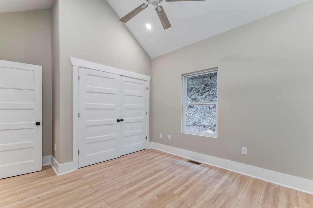 79 Logan Lane Ellijay, GA 30540 - Photo 41 of 56 a view of an empty room and wooden floor