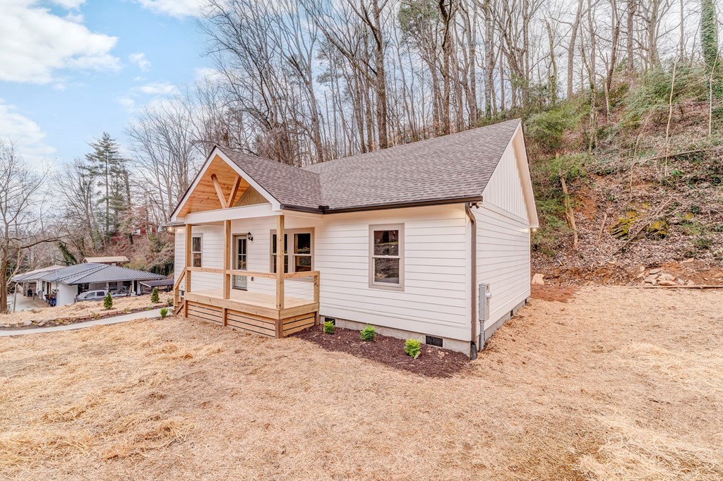 79 Logan Lane Ellijay, GA 30540 - Photo 54 of 56 a view of house with backyard and trees in the background