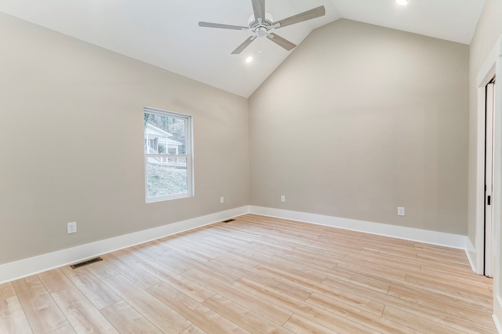 79 Logan Lane Ellijay, GA 30540 - Photo 10 of 56 wooden floor in an empty room with a window