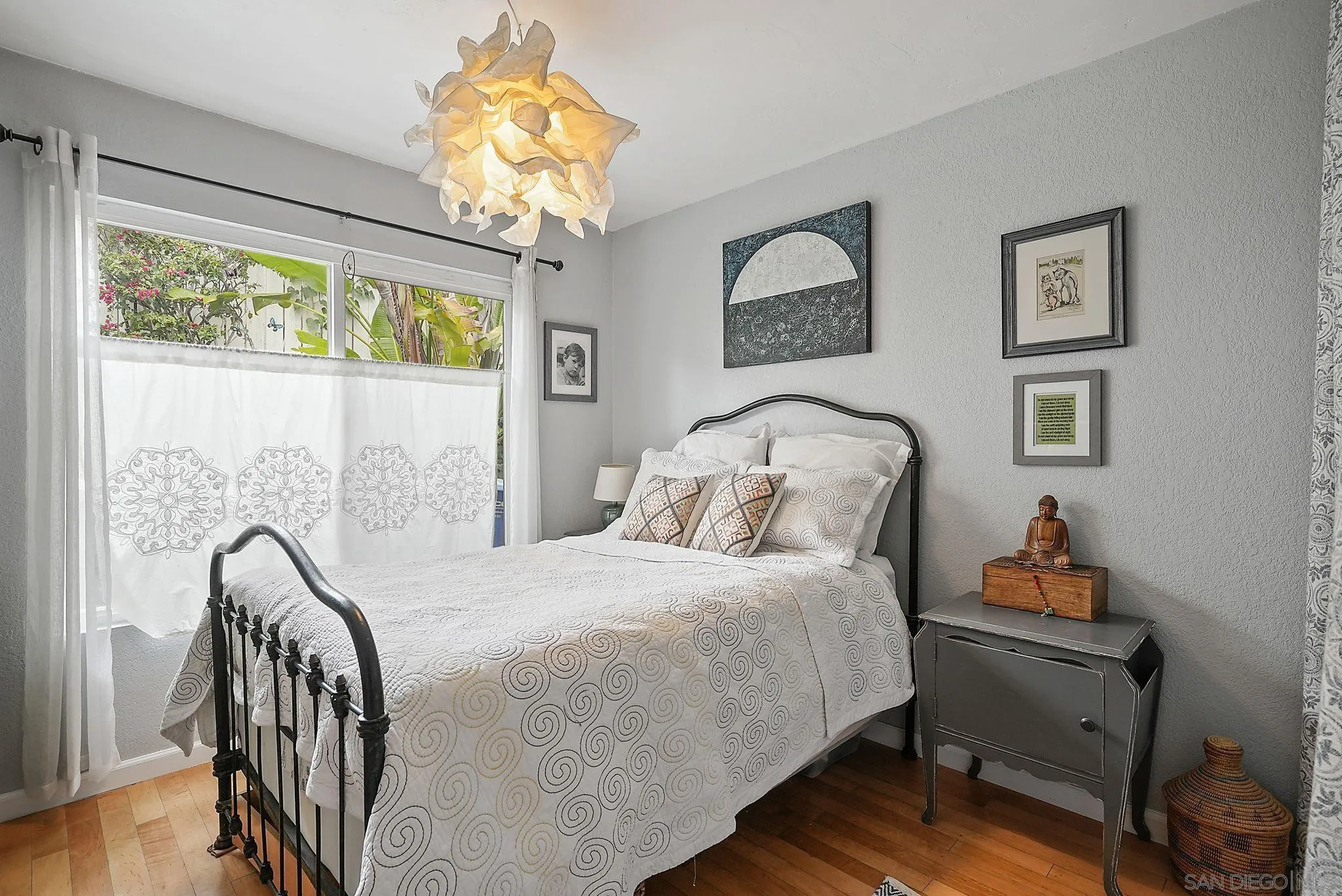 434 Jolina Way Encinitas, CA 92024 - Photo 16 of 25 a bedroom with a bed and a chandelier