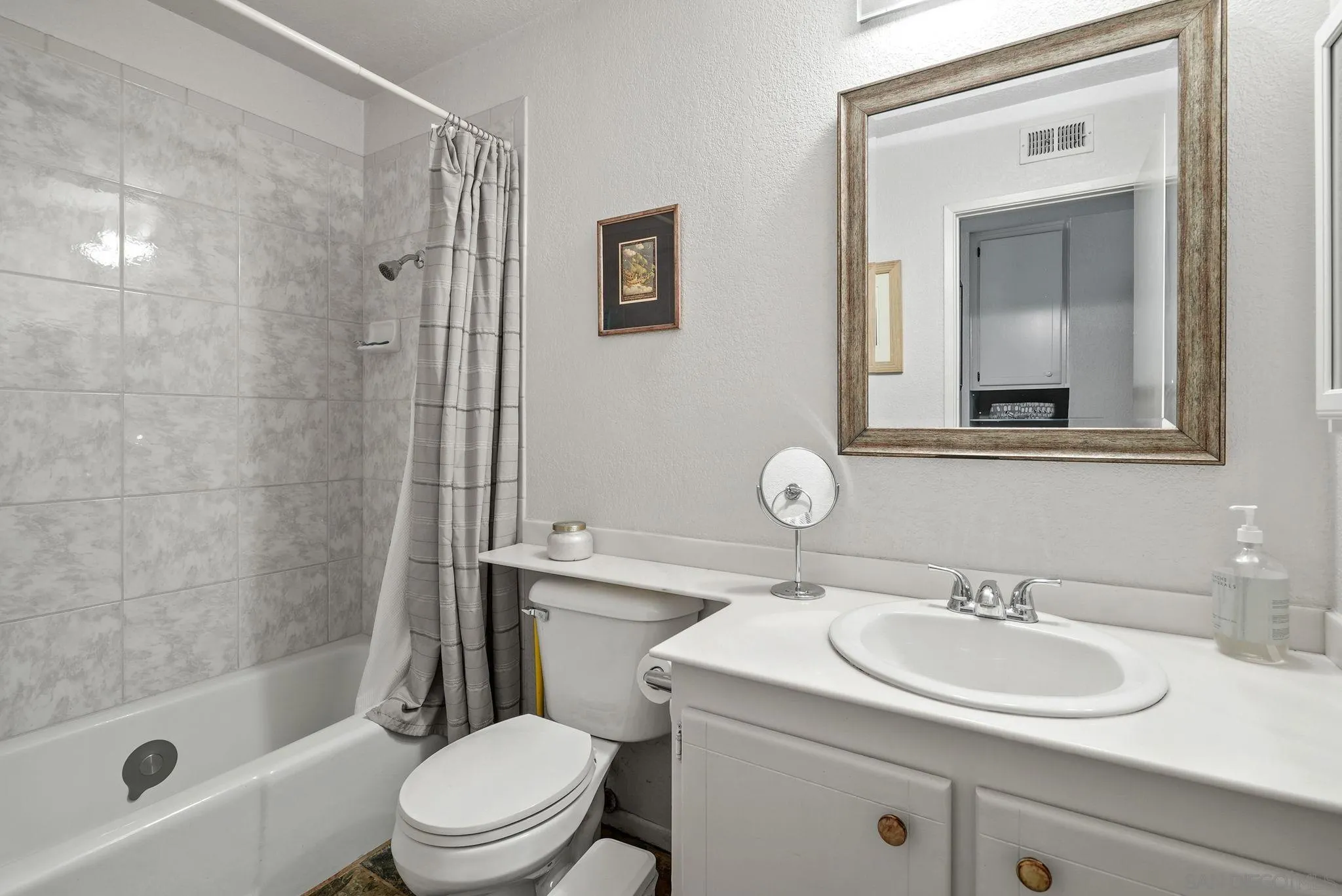 434 Jolina Way Encinitas, CA 92024 - Photo 17 of 25 a bathroom with a sink a toilet and shower