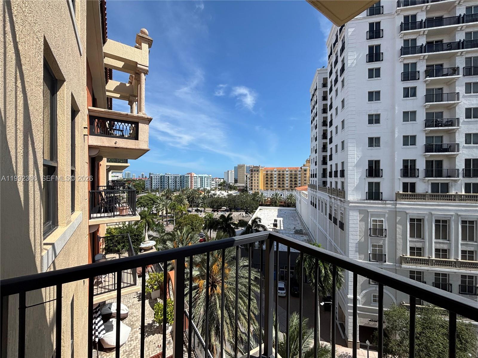 55 Merrick Way, Unit 702 Coral Gables, FL 33134 - Photo 14 of 17 a view of a balcony with a street