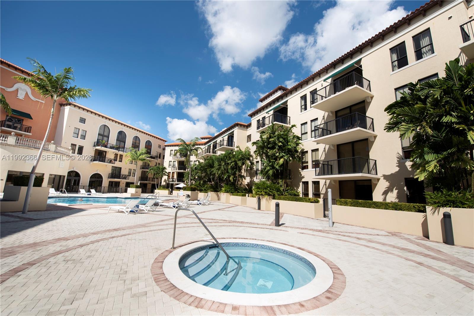 55 Merrick Way, Unit 702 Coral Gables, FL 33134 - Photo 17 of 17 a view of a building with a swimming pool