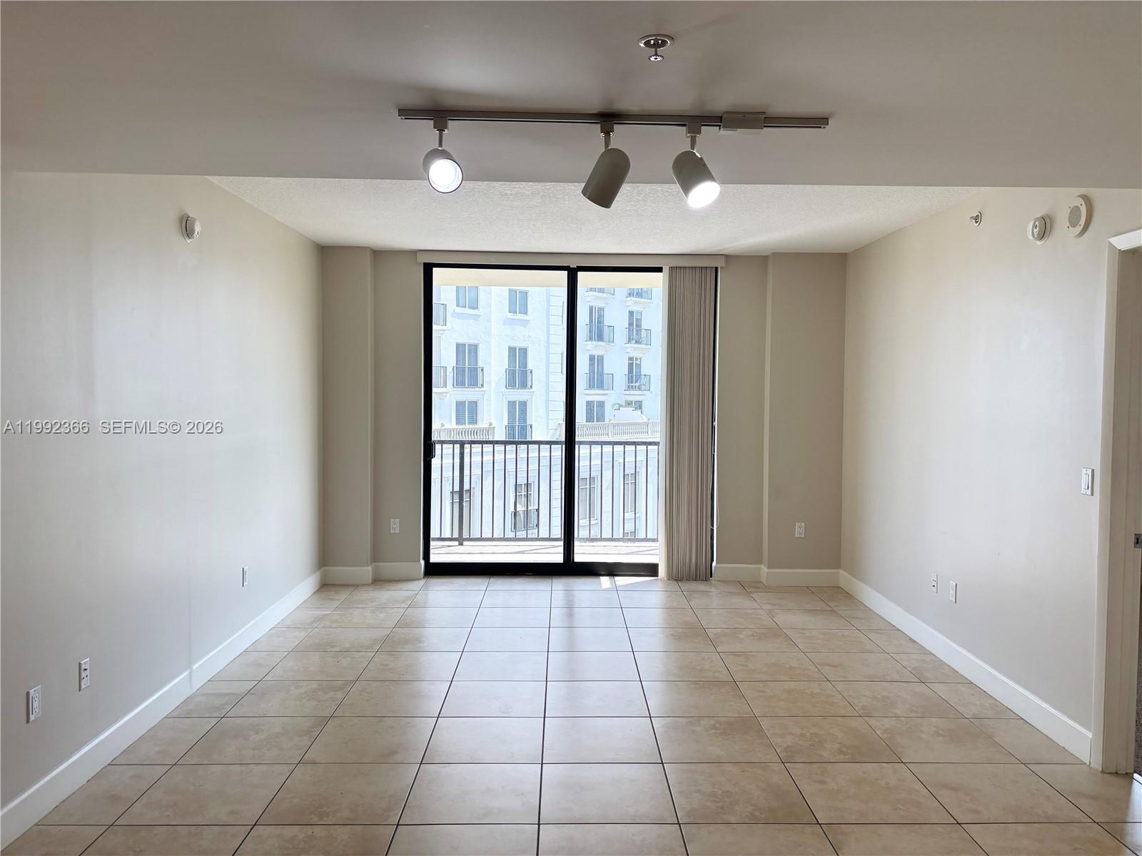 55 Merrick Way, Unit 702 Coral Gables, FL 33134 - Photo 2 of 17 a view of an empty room with a window