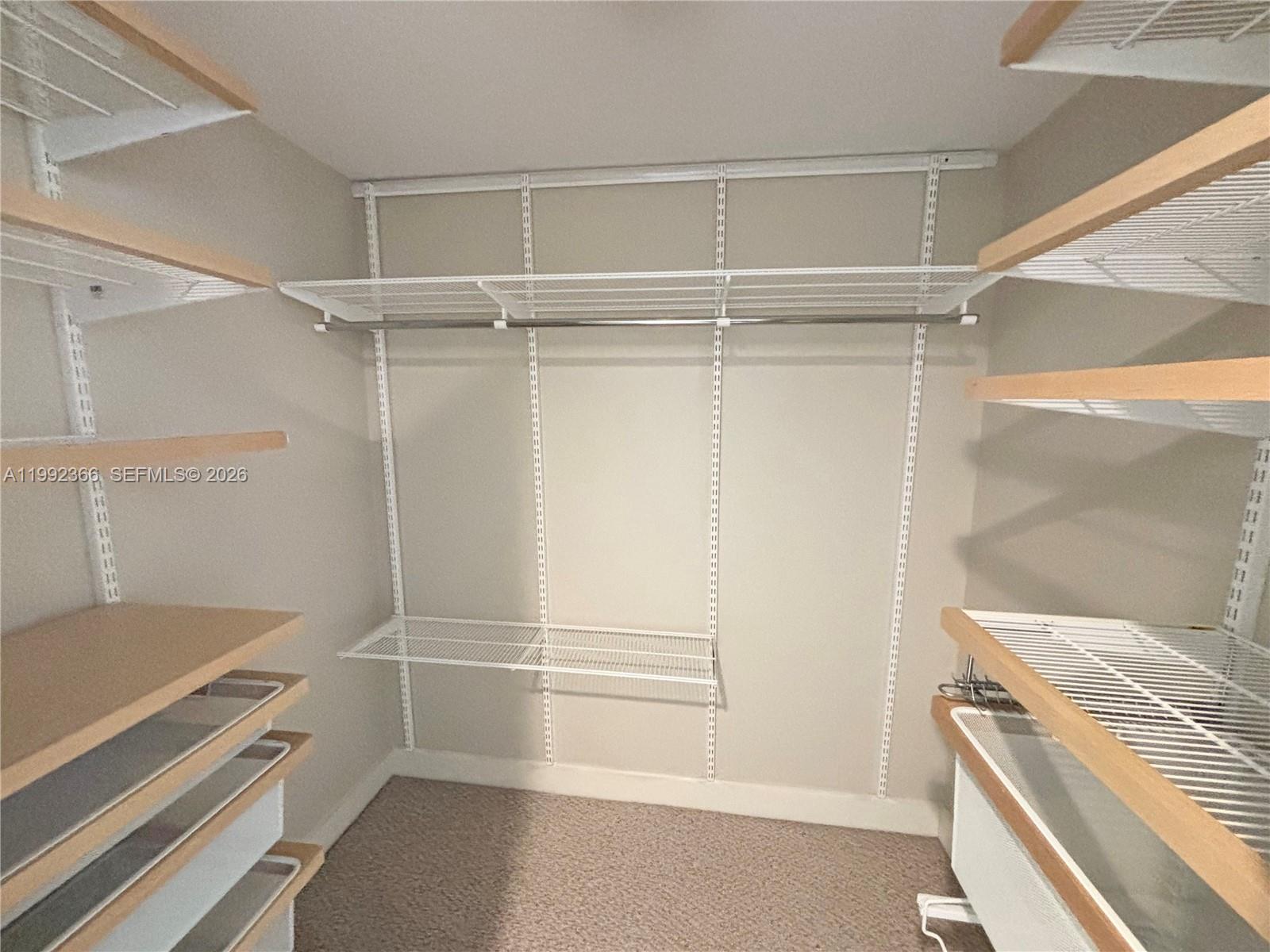 55 Merrick Way, Unit 702 Coral Gables, FL 33134 - Photo 10 of 17 a view of an empty walk in closet