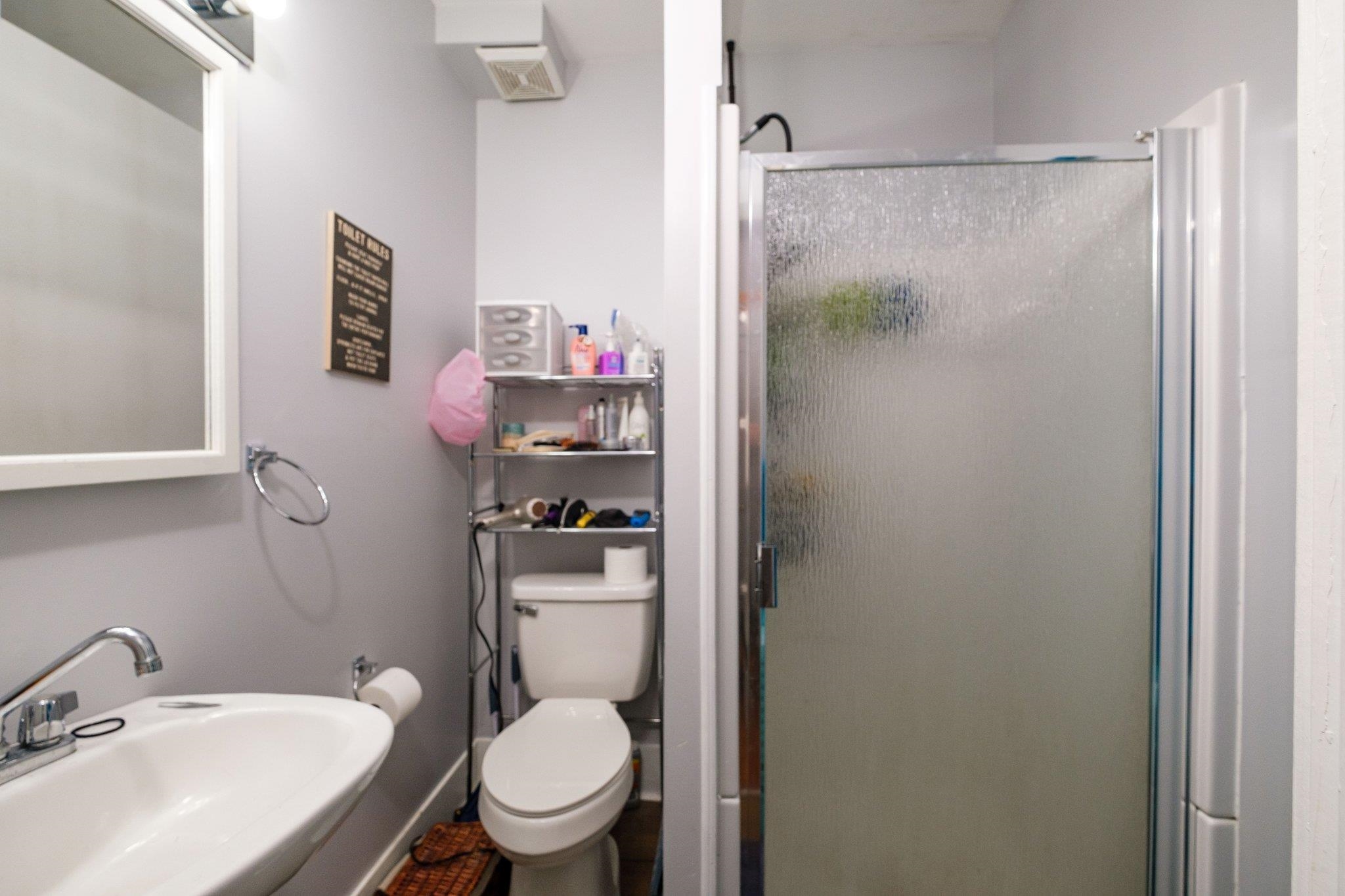 1057 Park Road Harrisonburg, VA 22802 - Photo 12 of 24 a bathroom with a sink toilet and vanity