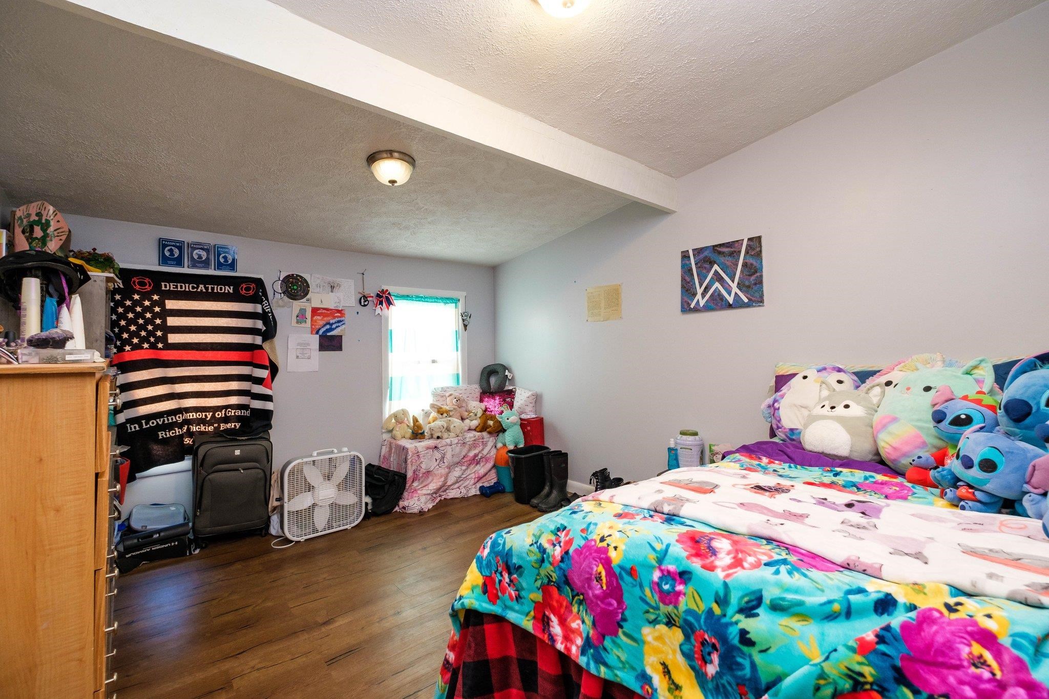 1057 Park Road Harrisonburg, VA 22802 - Photo 18 of 24 a bedroom with a bed and wooden floor