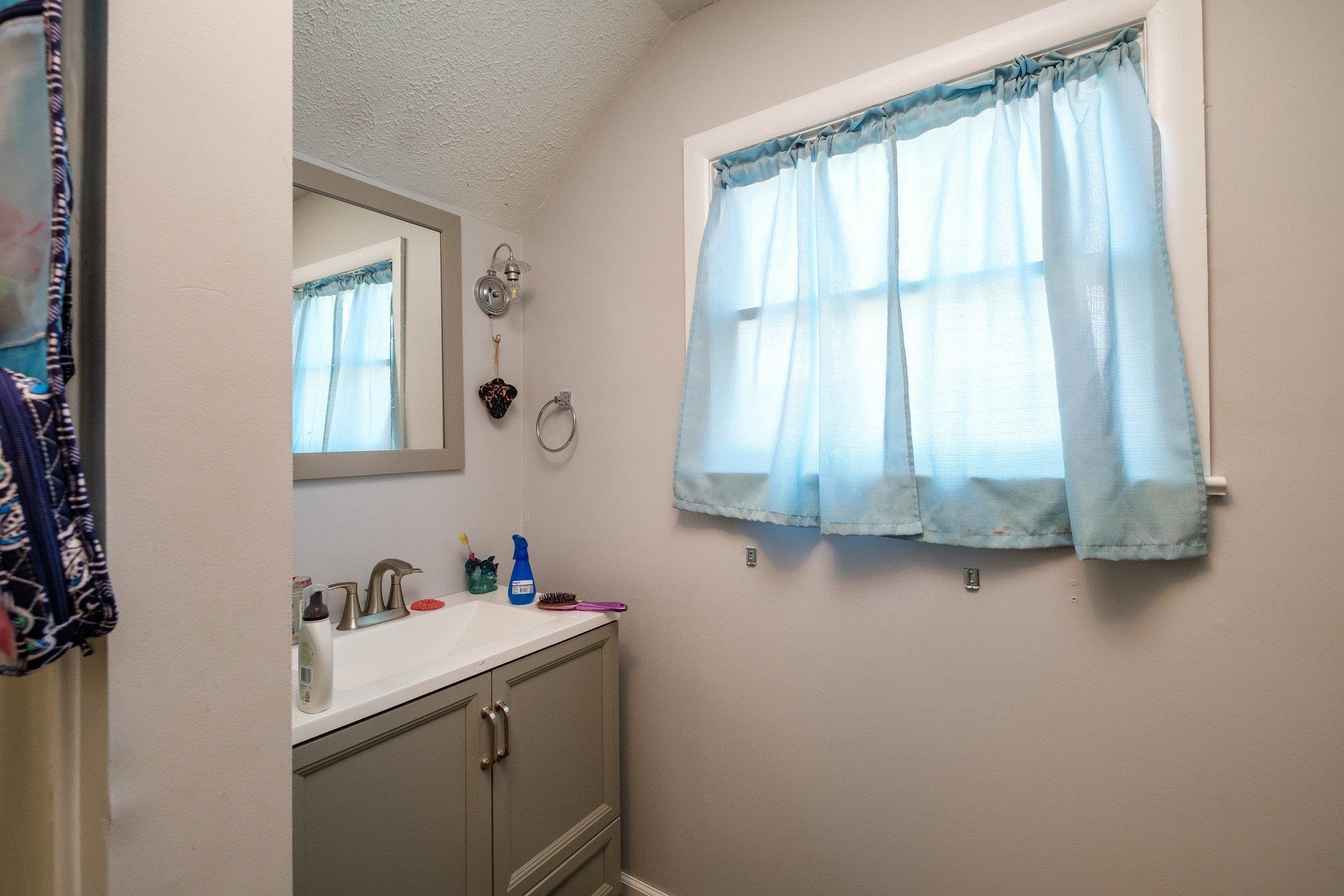 1057 Park Road Harrisonburg, VA 22802 - Photo 22 of 24 a bathroom with a sink and a window