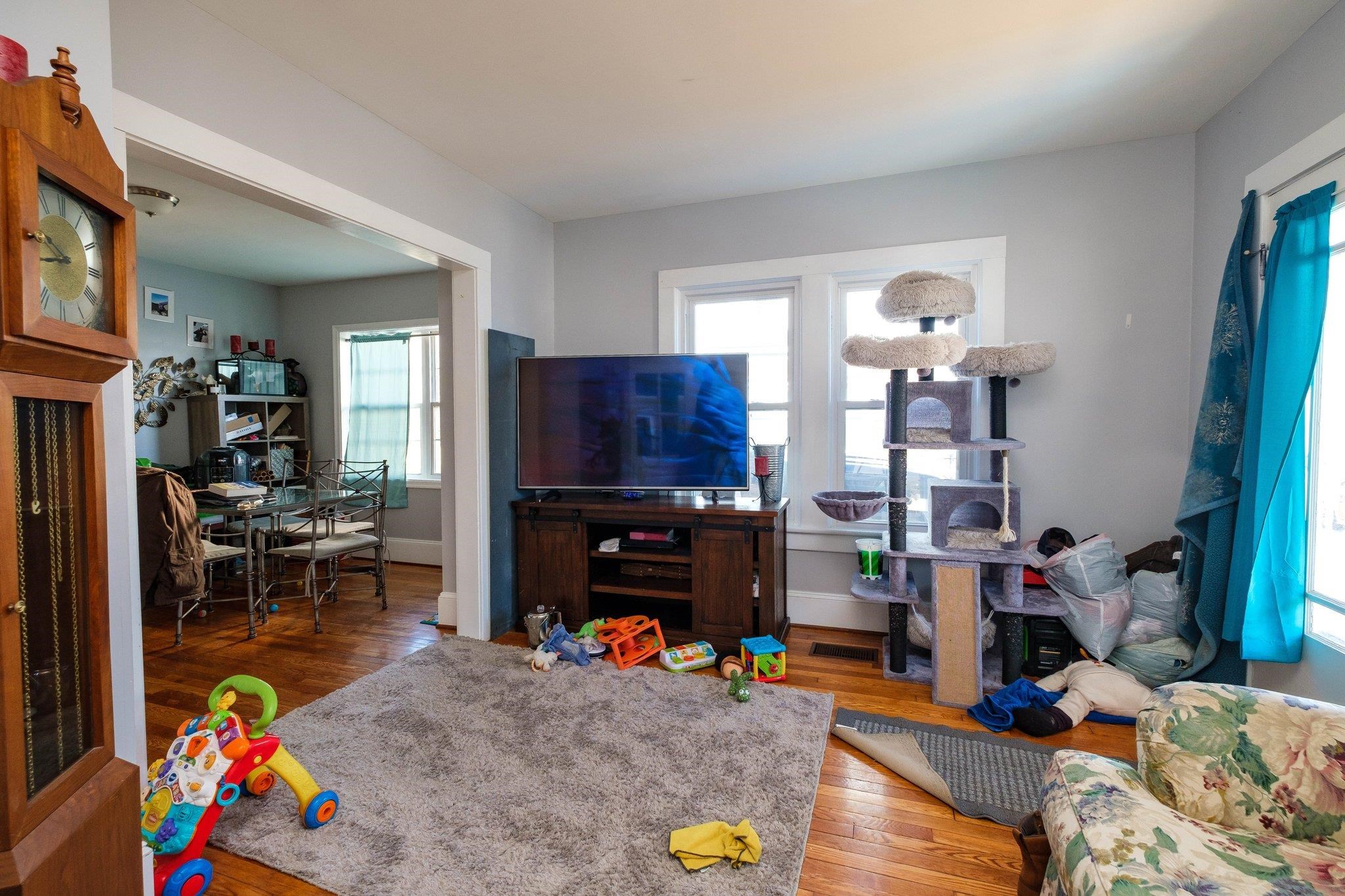 1057 Park Road Harrisonburg, VA 22802 - Photo 24 of 24 a living room with furniture a flat screen tv and a dining table