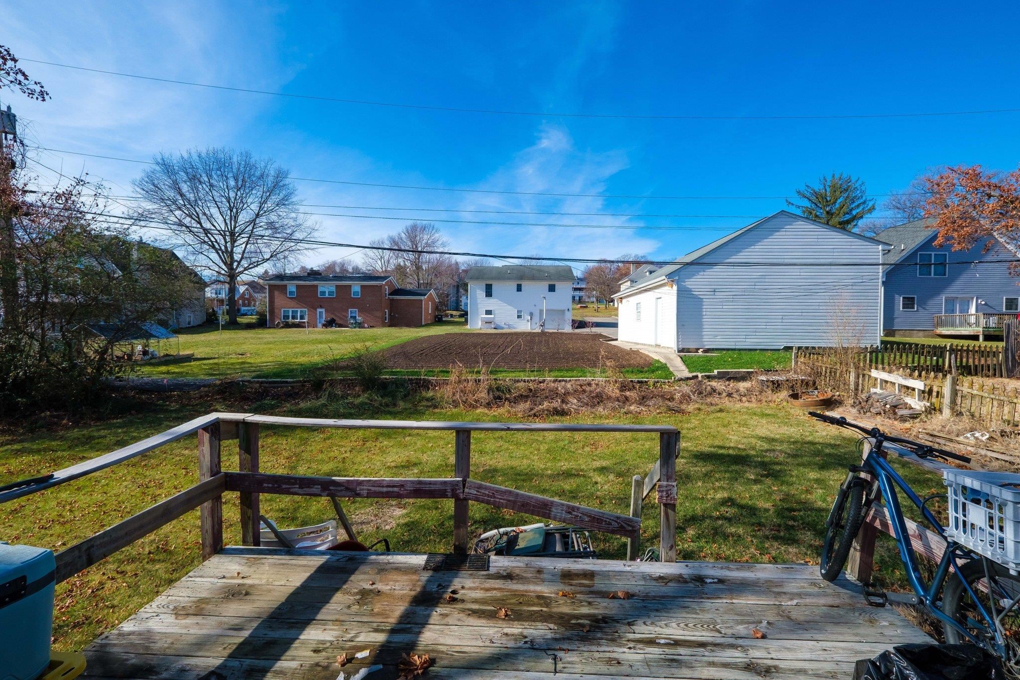 1057 Park Road Harrisonburg, VA 22802 - Photo 6 of 24 a view of a terrace with a bench and wooden floor