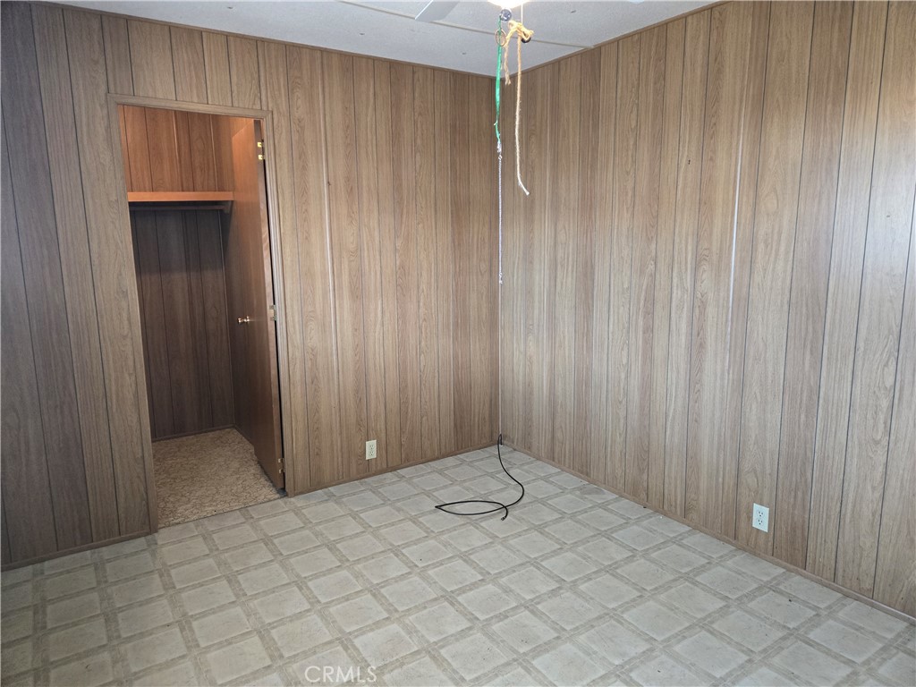 1700 State, Unit 56 Hemet, CA 92543 - Photo 8 of 10 a view of a room with wooden walls