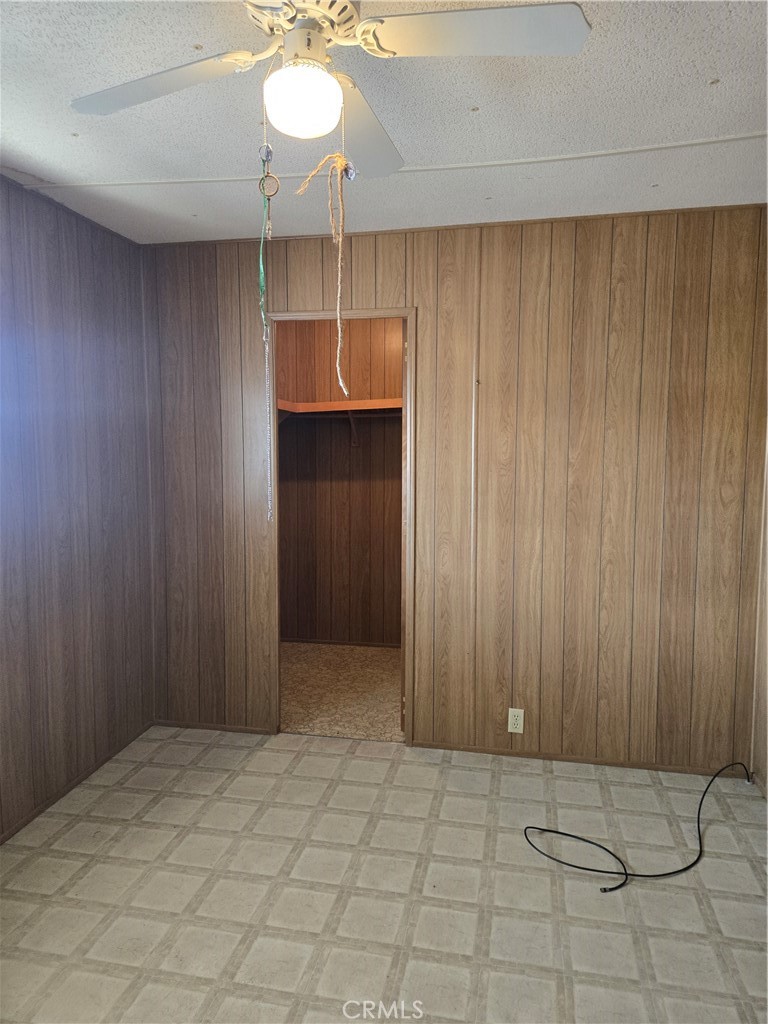 1700 State, Unit 56 Hemet, CA 92543 - Photo 9 of 10 a view of a room with a hanging light and hardwood