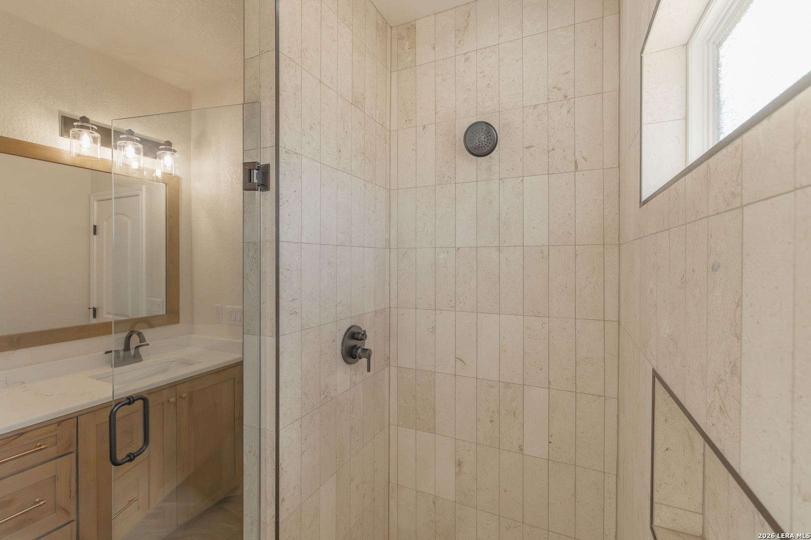 591 Eichman Road Poteet, TX 78065 - Photo 5 of 22 a bathroom with a shower and a sink