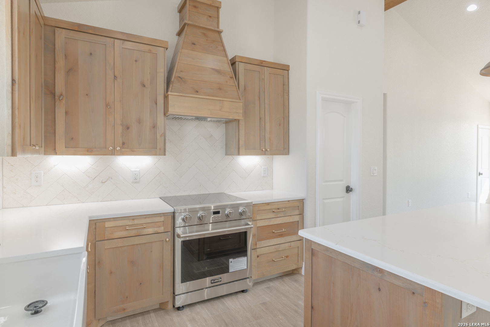 591 Eichman Road Poteet, TX 78065 - Photo 6 of 22 a kitchen with a stove and a sink
