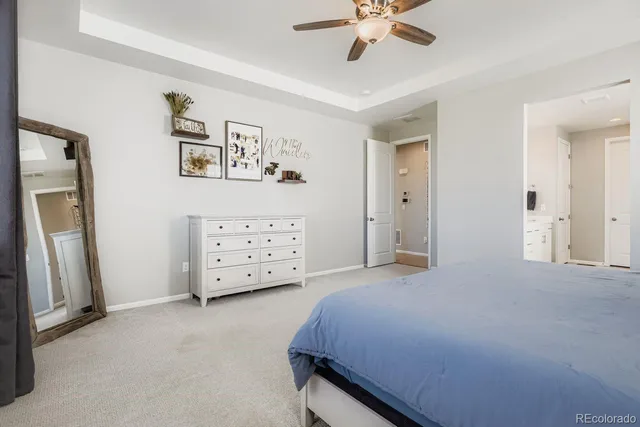 a bedroom with a bed and a view of room