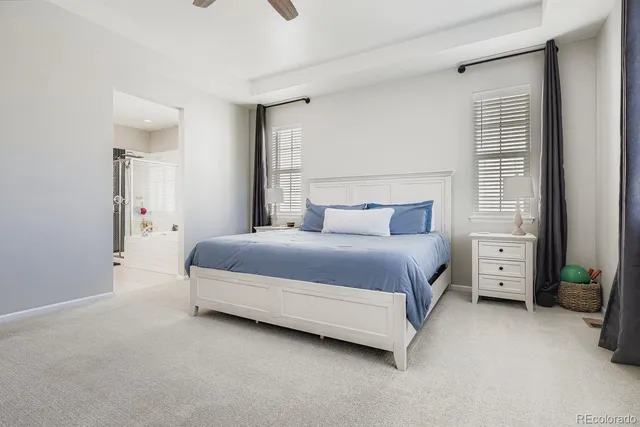 a bedroom with a bed and a flat tv screen