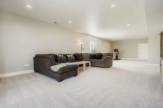a living room with furniture and a couch