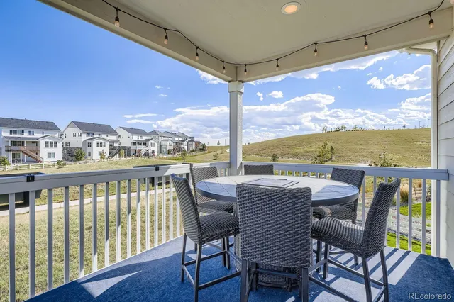 a view of a balcony with furniture