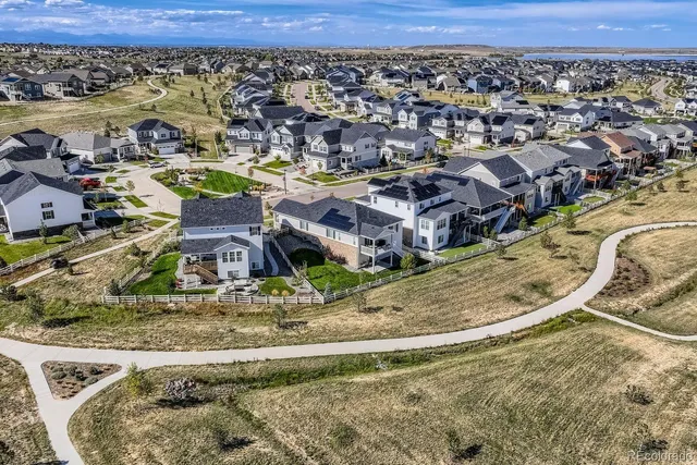 an aerial view of a house with a ocean view