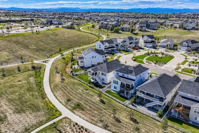 an aerial view of a house with a ocean view