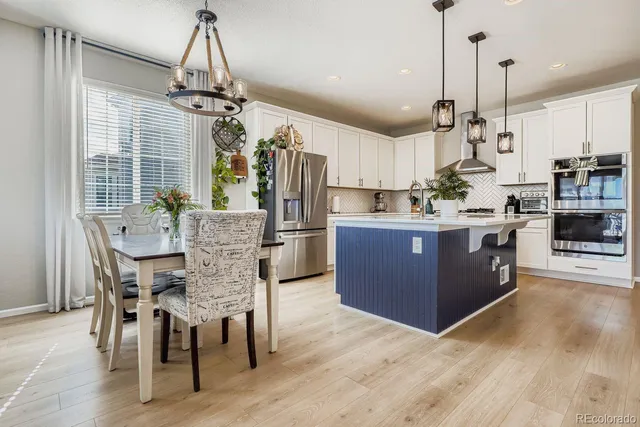a view of a kitchen and dining room
