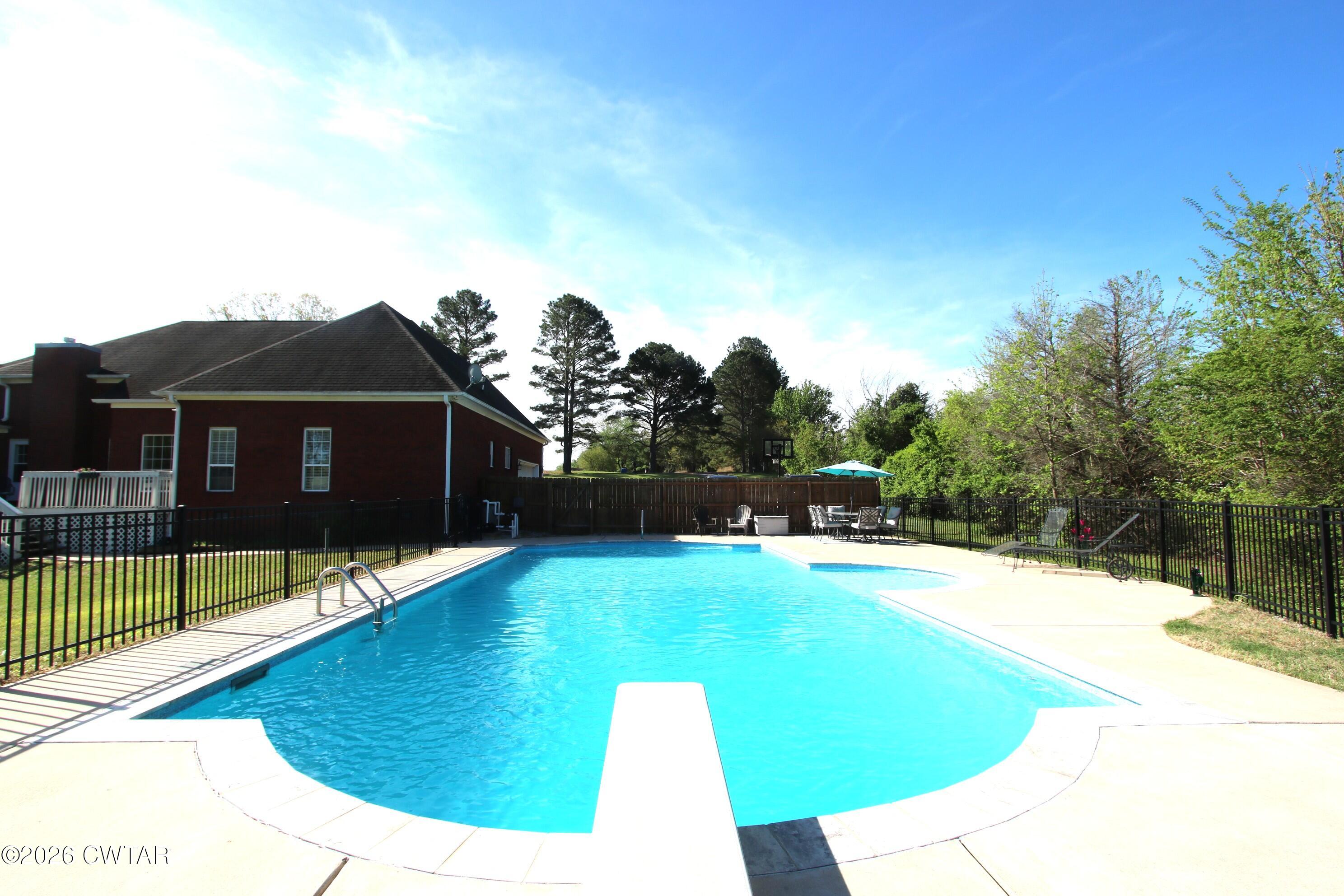 98 Browning Road Milan, TN 38358 - Photo 4 of 60 a view of swimming pool with seating space
