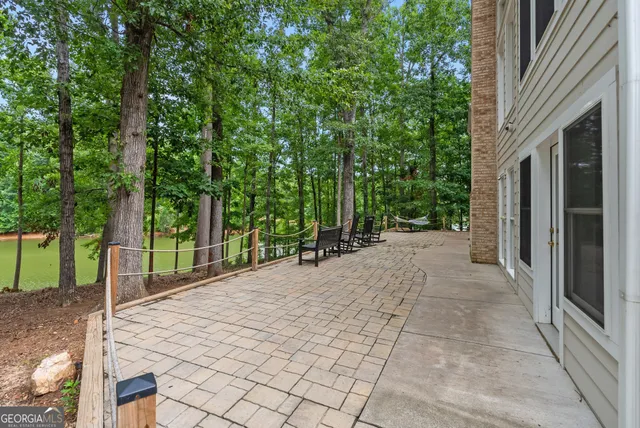 a wooden bench sitting on top of a wooden deck