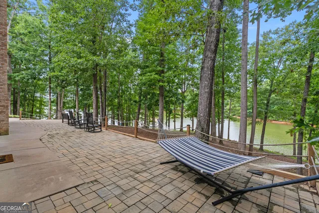 a view of a swimming pool with a porch