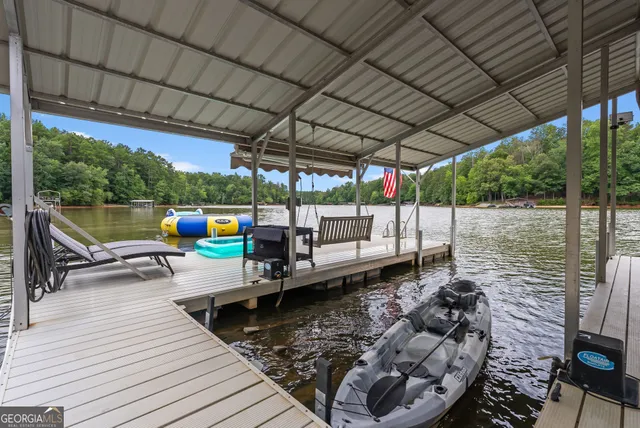 a living room with furniture fireplace and a large window