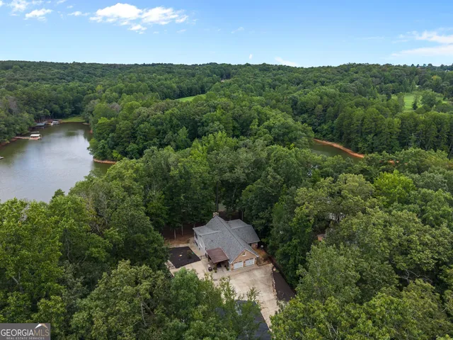 an aerial view of a house with mountain view
