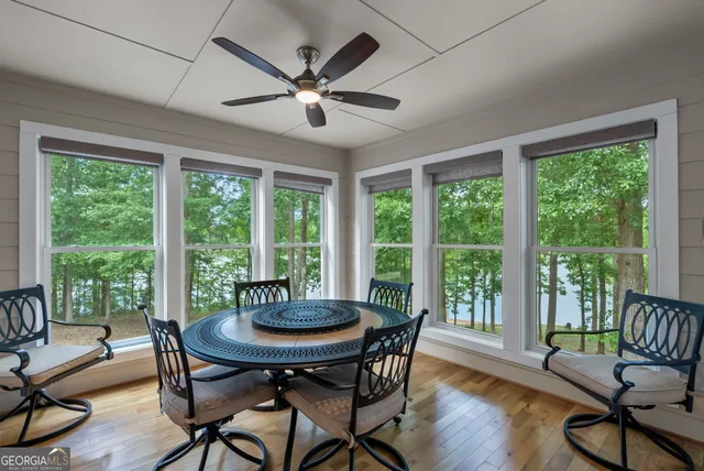 a spacious bedroom with a bed and a chandelier