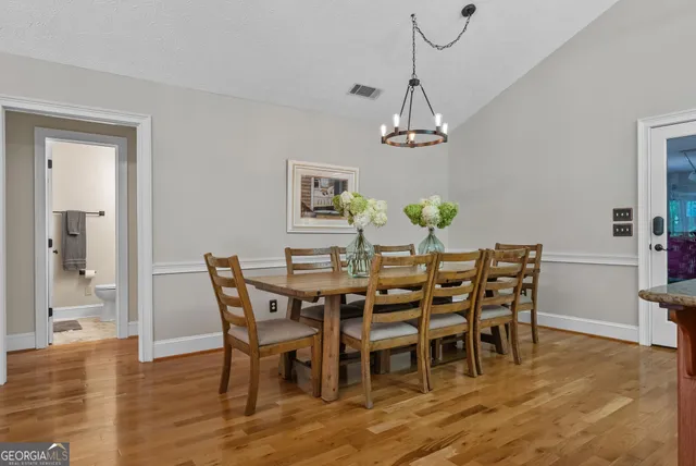 a bedroom with a bed and a ceiling fan