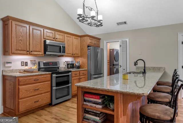 a bathroom with double sink and a mirror