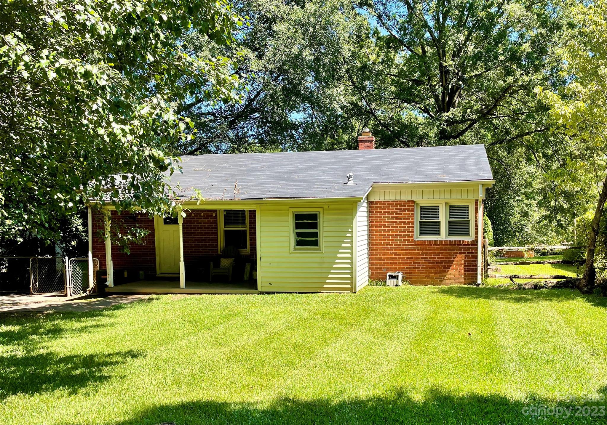 2224 Falmouth Road Charlotte, NC 28205 - Photo 13 of 13 a view of a house with a yard and tree
