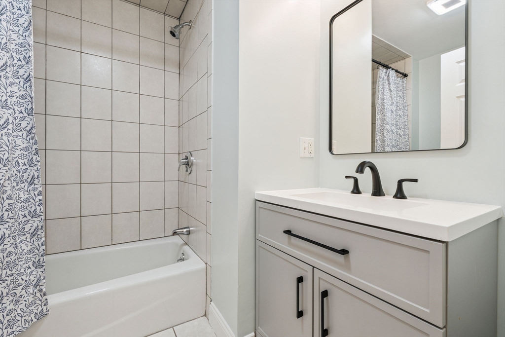 172 Cottage Street, Unit 2 Boston, MA 02128 - Photo 16 of 33 a bathroom with a bathtub and a sink
