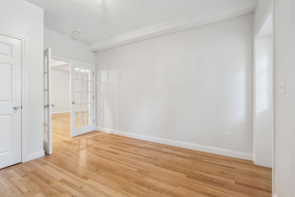 172 Cottage Street, Unit 2 Boston, MA 02128 - Photo 22 of 33 a view of an empty room with wooden floor