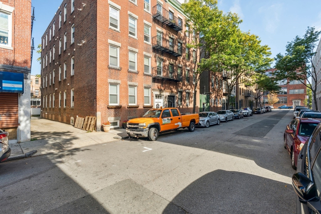 172 Cottage Street, Unit 2 Boston, MA 02128 - Photo 28 of 33 a view of a street with cars