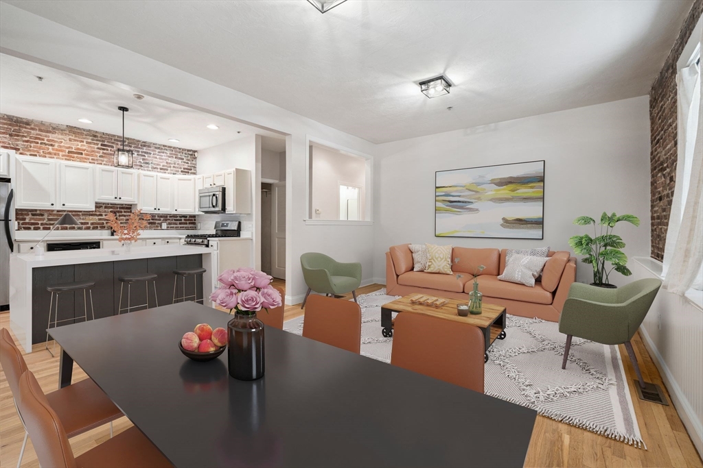 172 Cottage Street, Unit 2 Boston, MA 02128 - Photo 3 of 33 a living room with furniture kitchen and a table