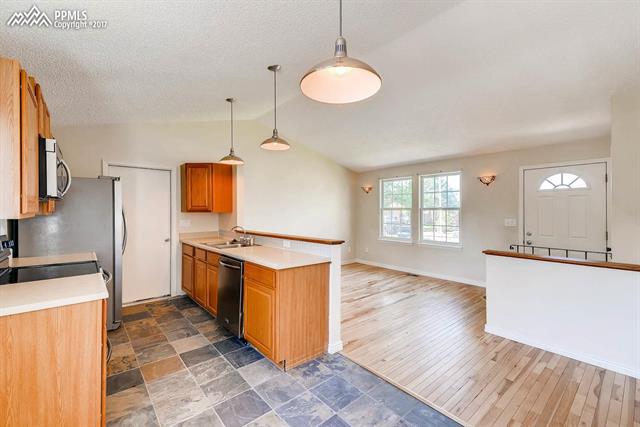 1875 Doherty Road Colorado Springs, CO 80916 - Photo 4 of 11 Open concept, perfect for entertaining family and friends