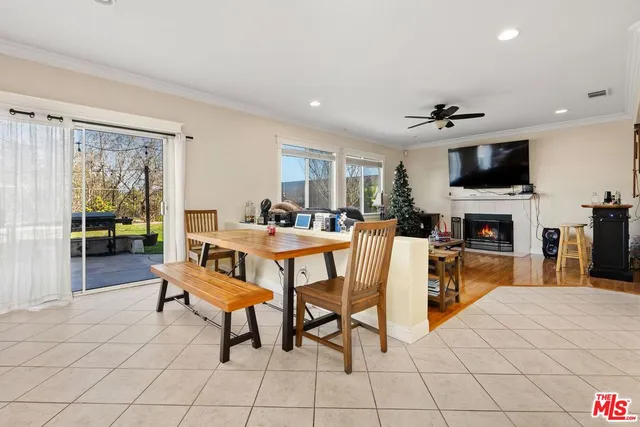 a living room with fireplace furniture and a flat screen tv