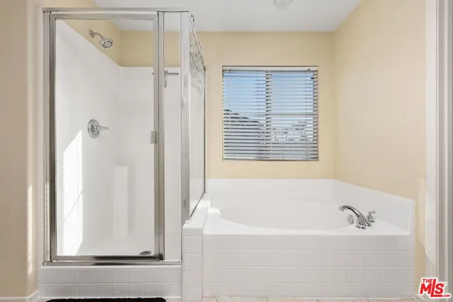 a white bath tub sitting next to a window