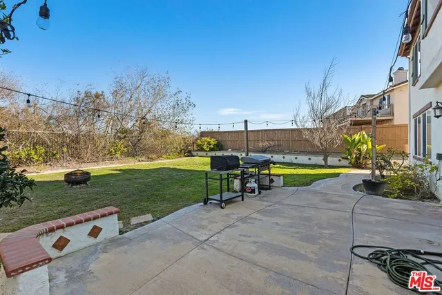 a view of a swimming pool and trees in the background