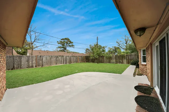 a view of backyard with green space