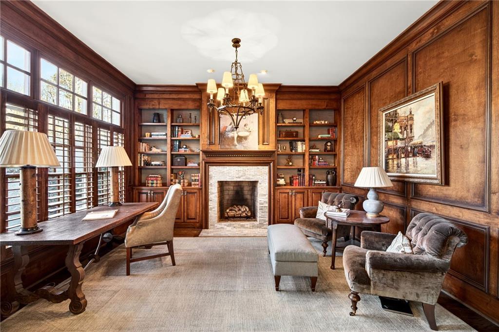 120 Burdette Trail Atlanta, GA 30327 - Photo 16 of 69 a living room with furniture a fireplace and large windows