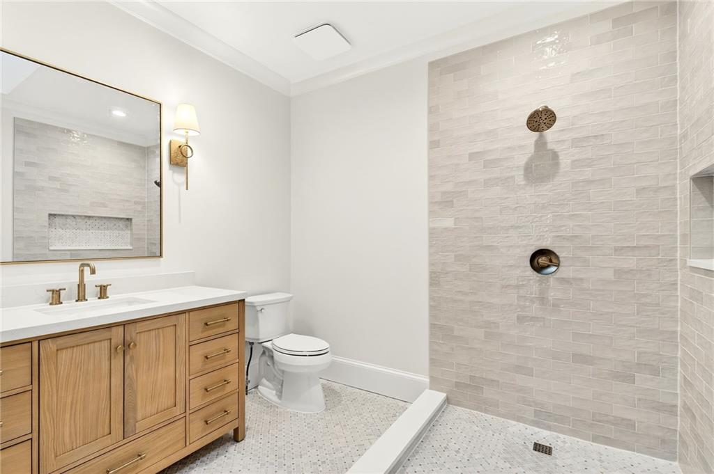 120 Burdette Trail Atlanta, GA 30327 - Photo 36 of 69 a bathroom with a granite countertop sink a toilet and a mirror