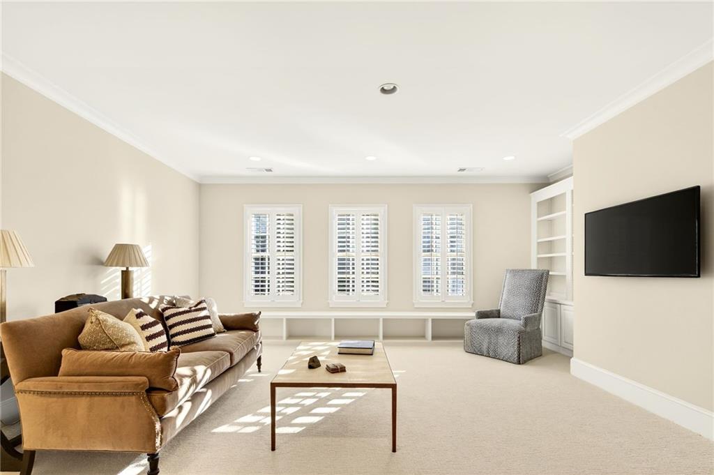 120 Burdette Trail Atlanta, GA 30327 - Photo 41 of 69 a living room with furniture and a flat screen tv