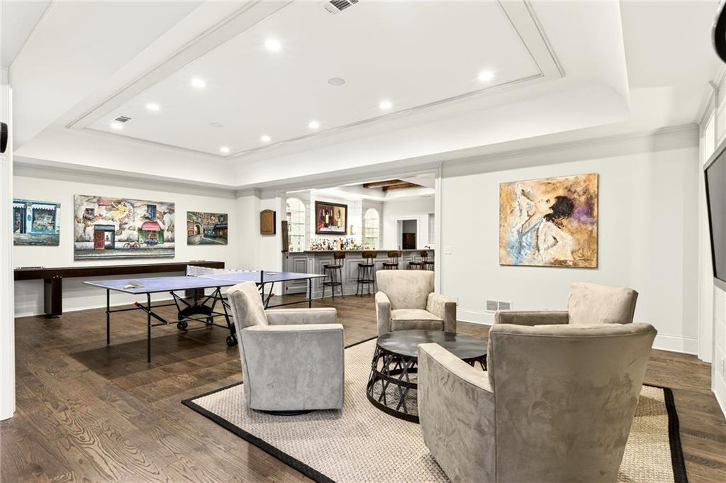 120 Burdette Trail Atlanta, GA 30327 - Photo 48 of 69 a living room with couches a coffee table and painting on the wall with wooden floor